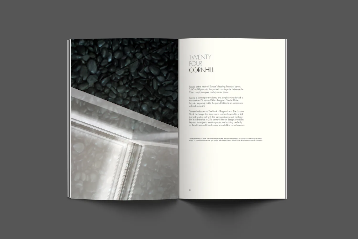 A brochure open on a page of text facing a photograph of the entrance.