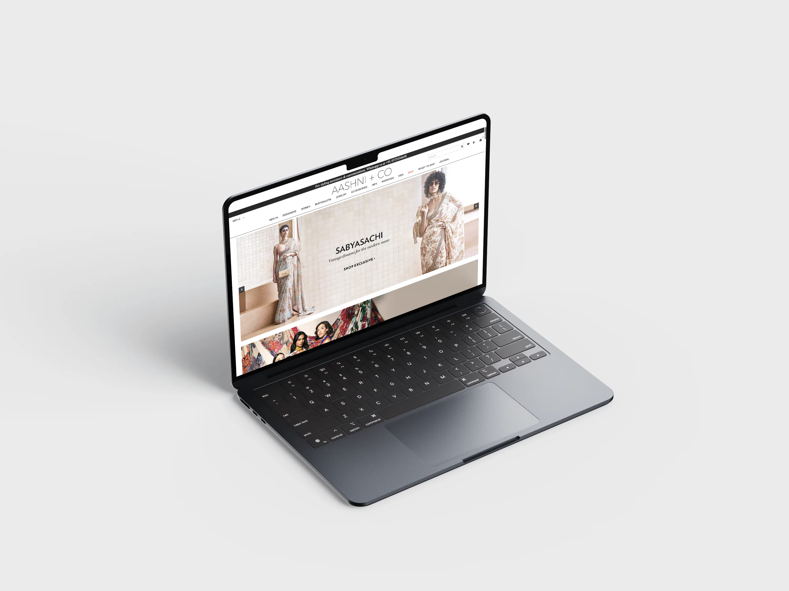 The Aashni + Co site open on a laptop, a Sabyasachi feature on screen.