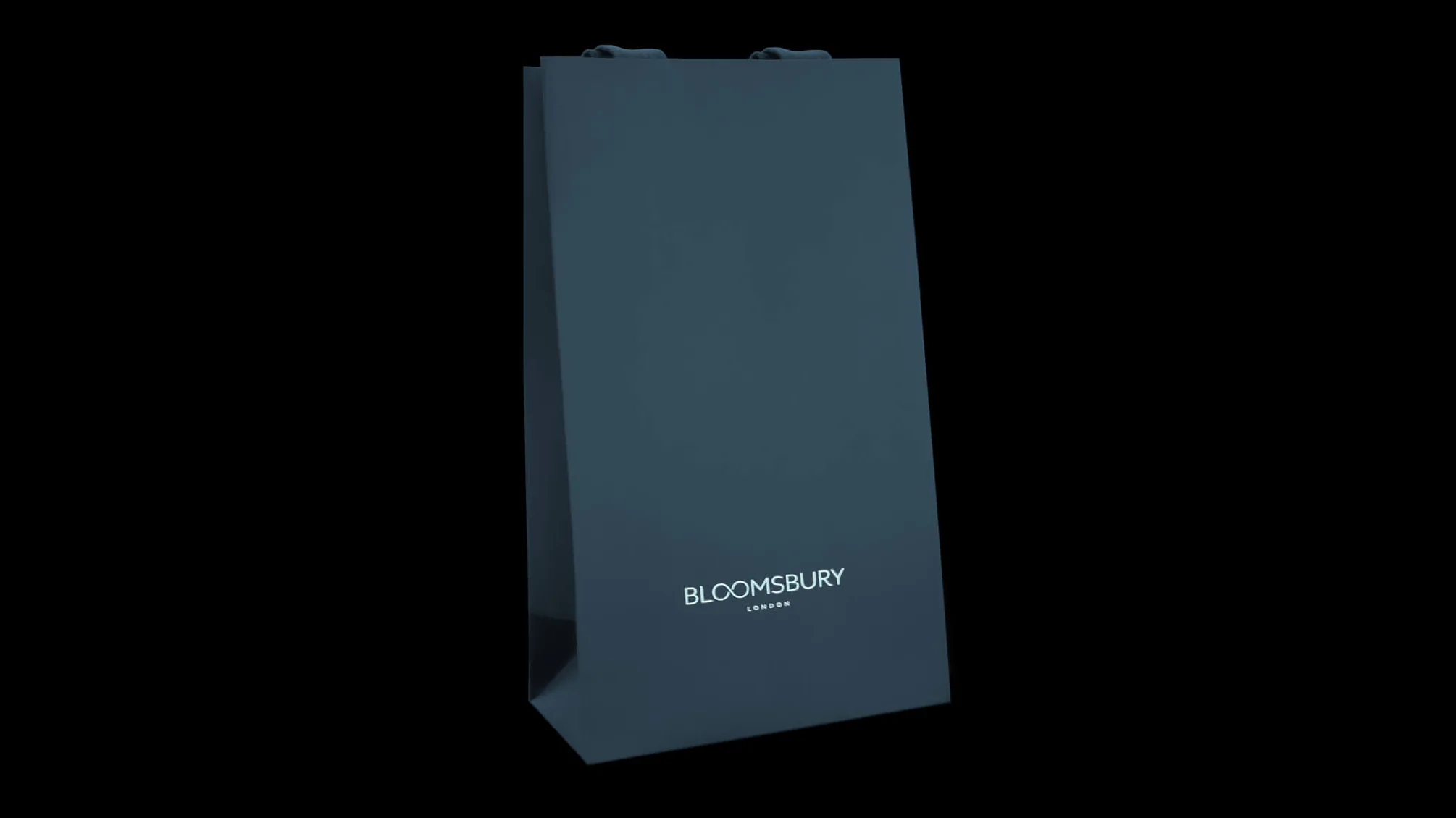 A teal carrier bag with rope handles, lit against black.