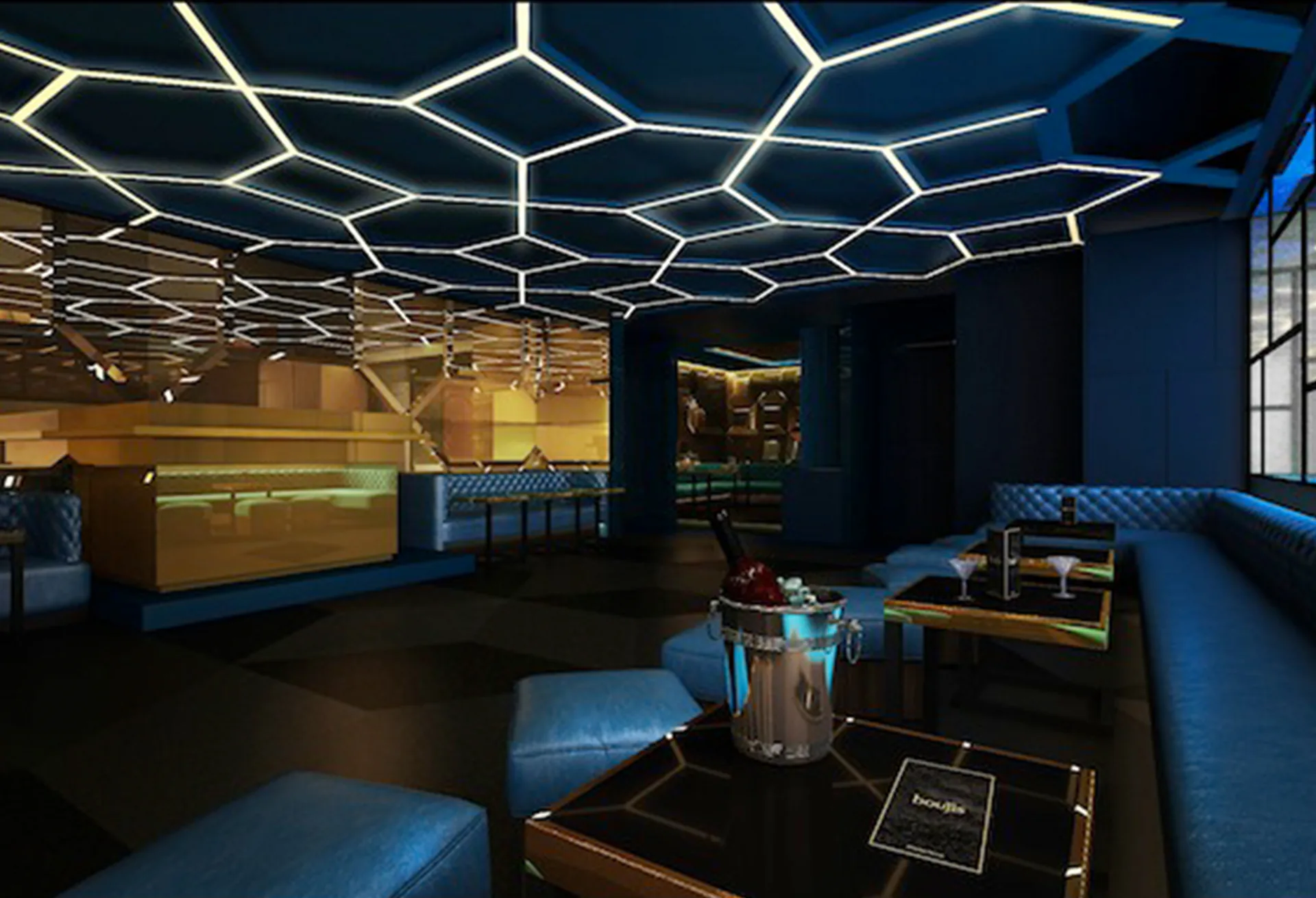 The hexagonal light rig across the ceiling above the bar and seating.