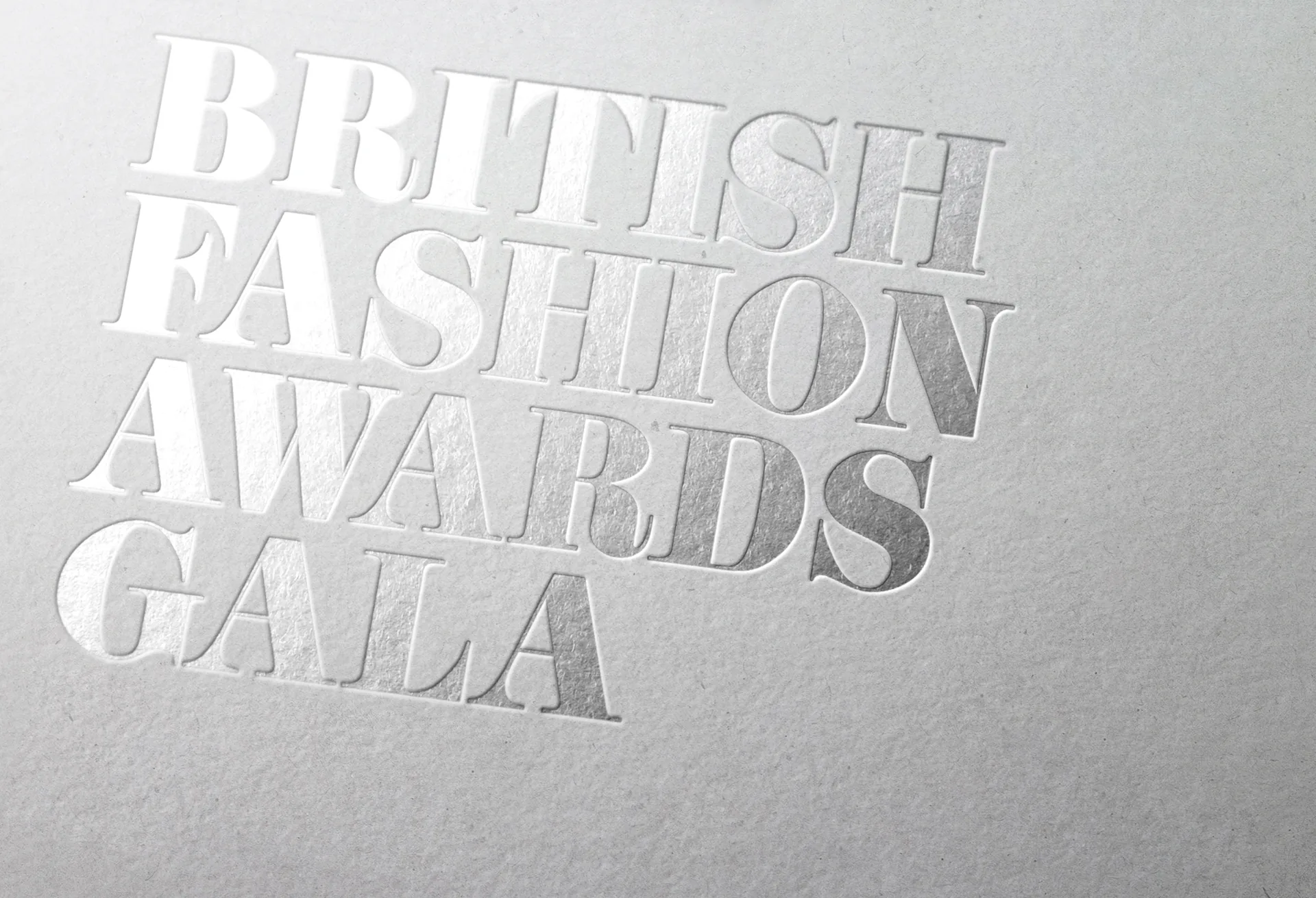 British Fashion Awards Gala set in raised spot varnish on white board.