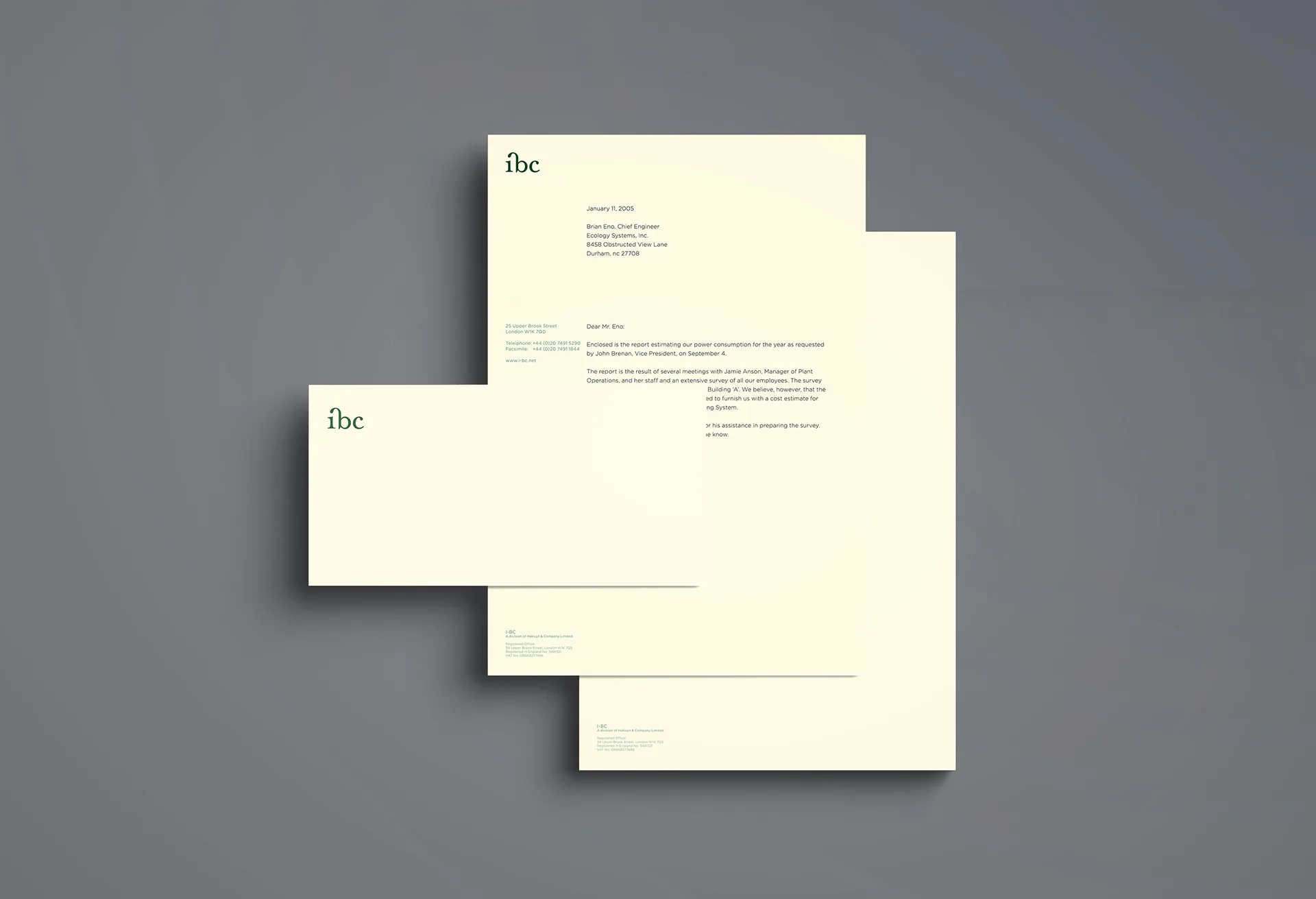 The ibc stationery set, a letterhead and two compliments slips overlapping.
