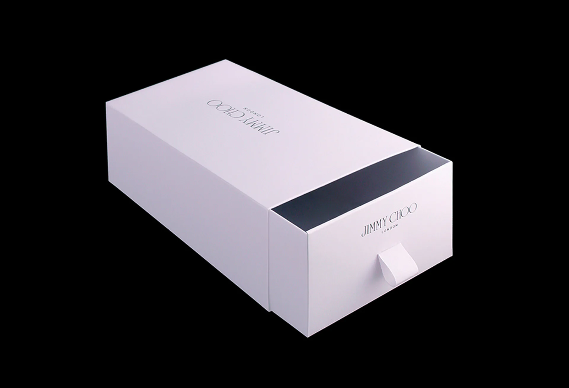 A white Jimmy Choo box with its printed sleeve.