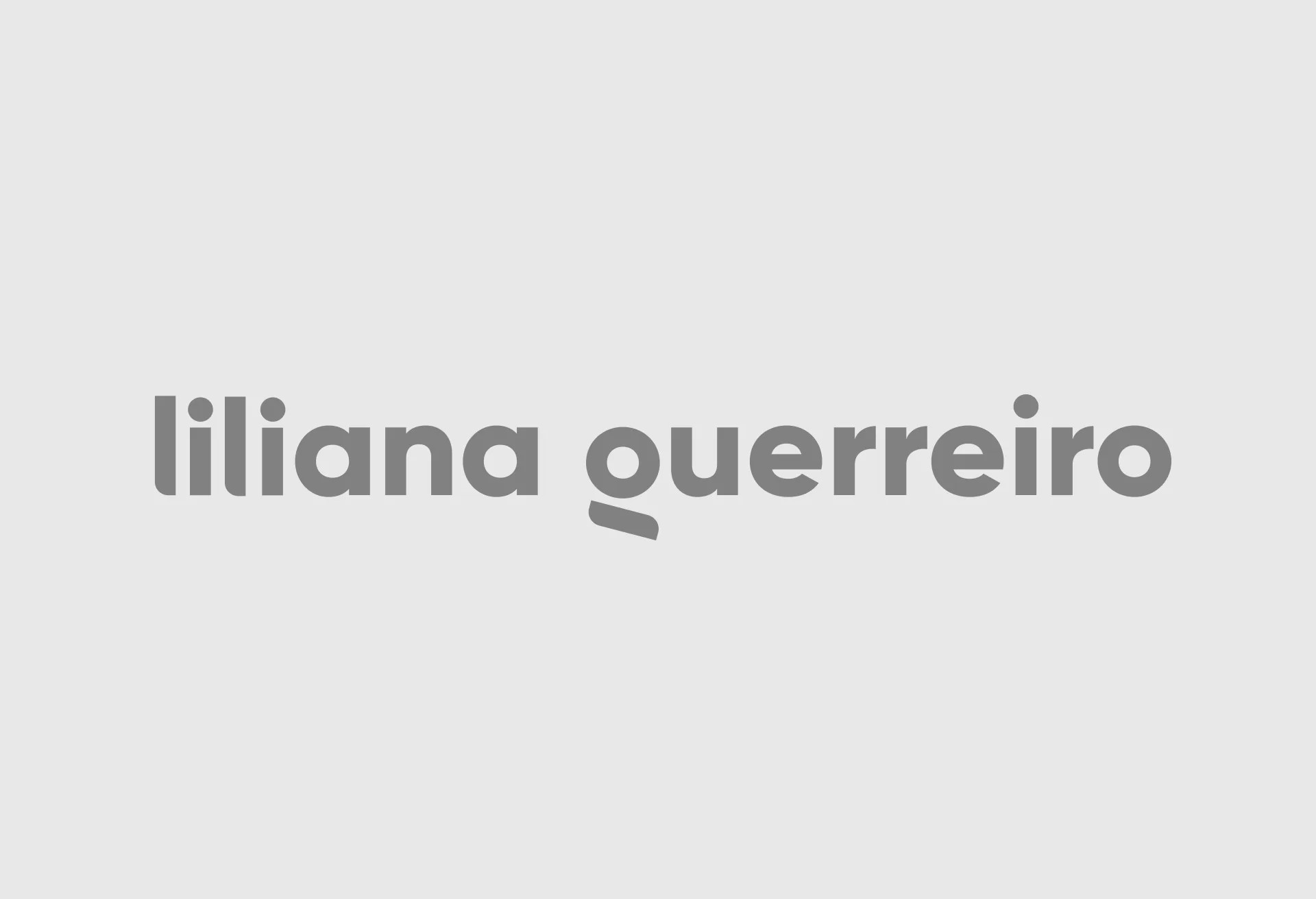 The liliana guerreiro logotype set in grey on a pale ground.