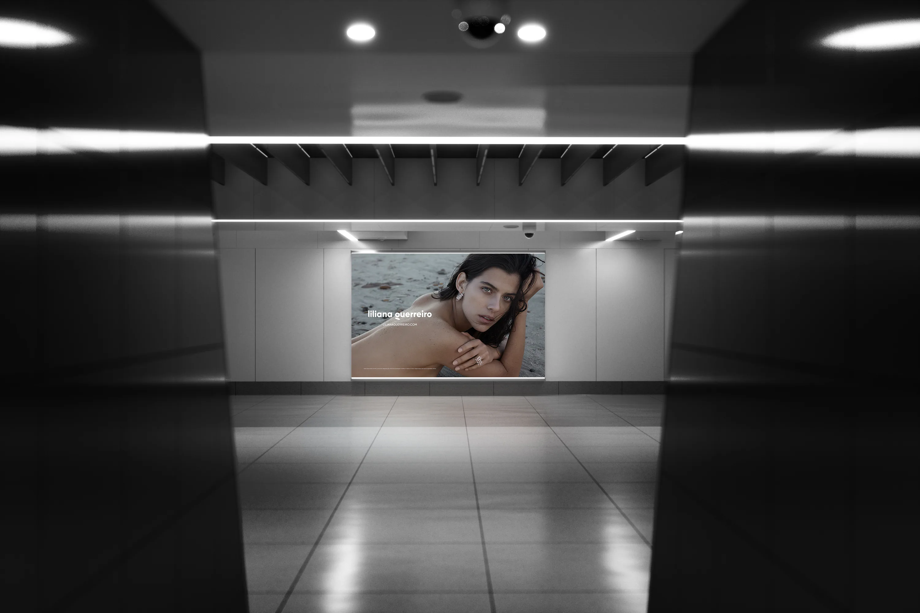 A lit campaign billboard at the end of a dark tiled corridor.