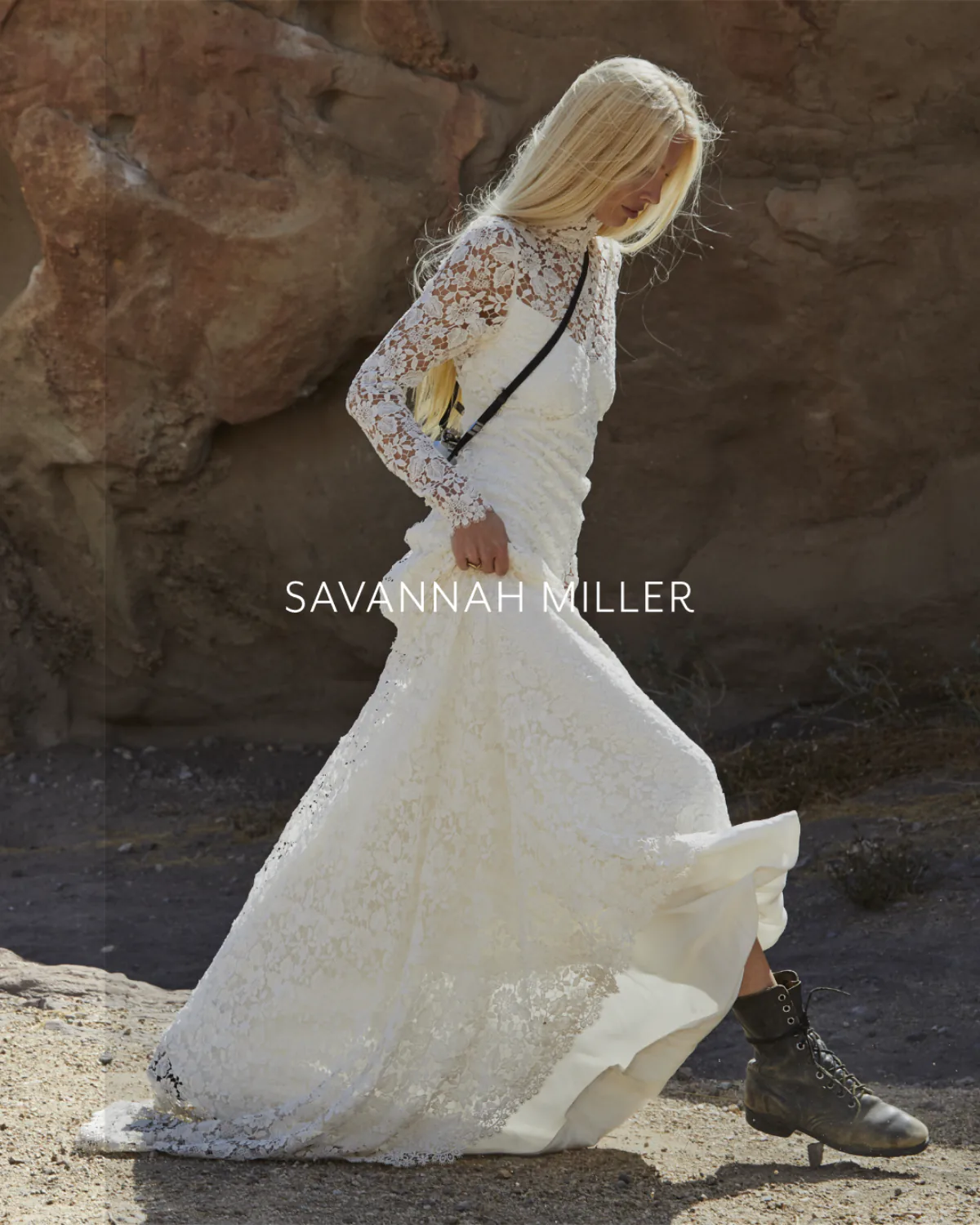 A model walking in a long lace gown against red rock, the SAVANNAH MILLER wordmark across the image.