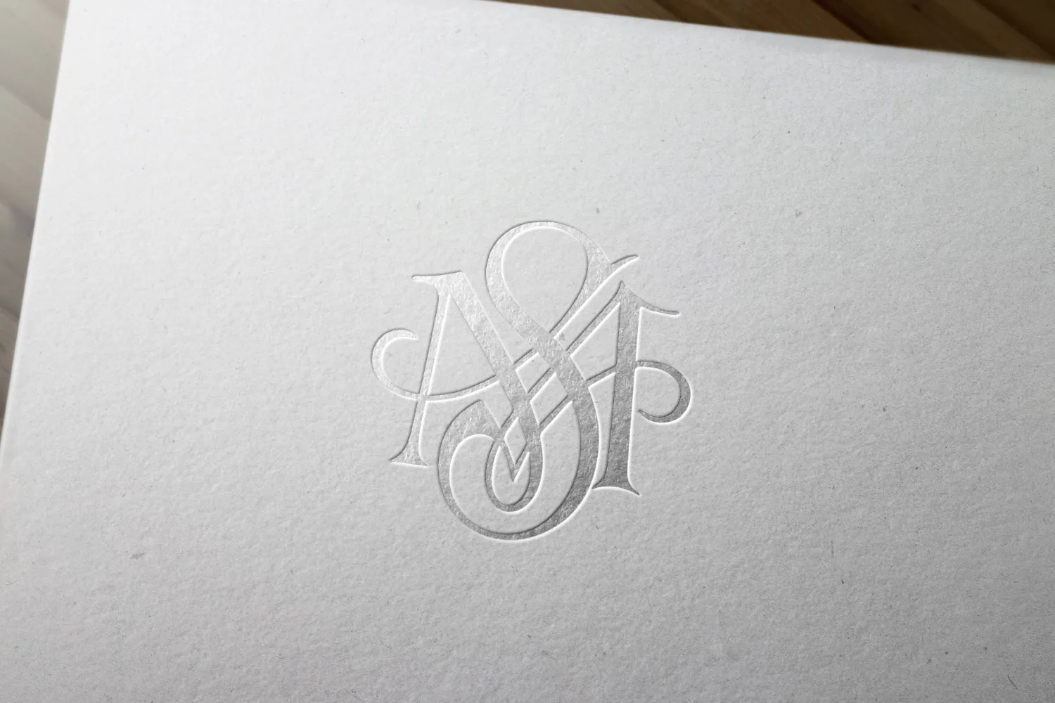 The Savannah Miller monogram foil-blocked into textured white board.